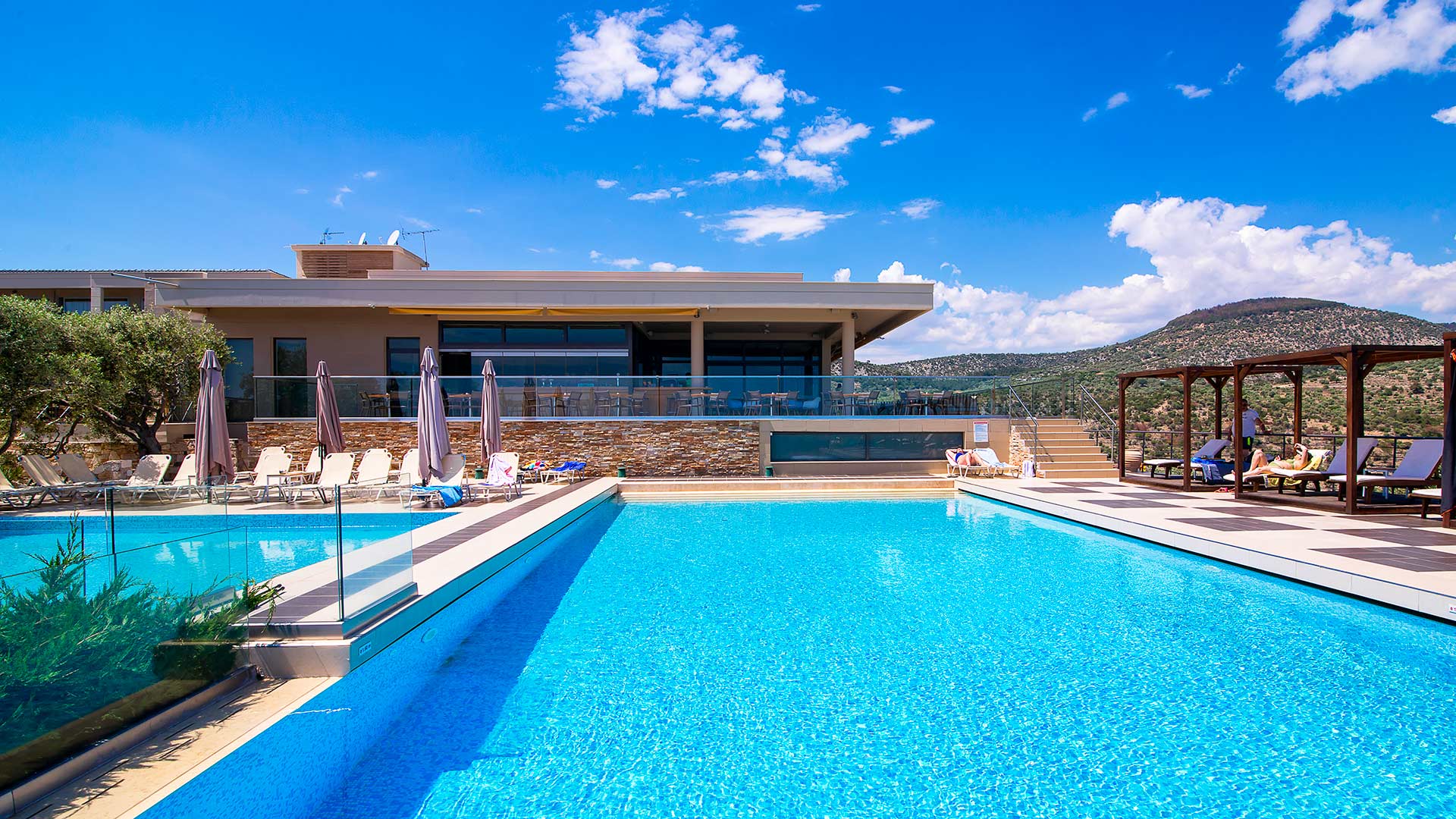 Umbrellas, sun loungers at the pool and beach 10