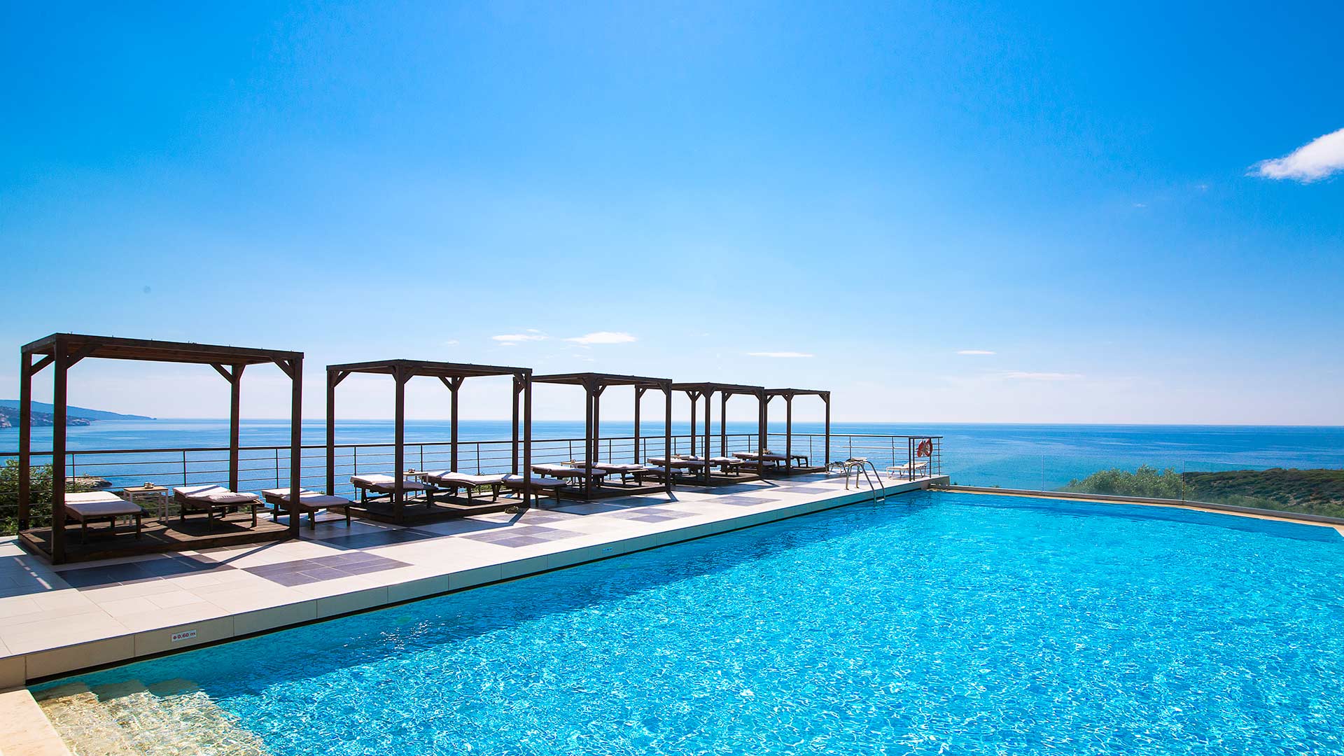 Umbrellas, sun loungers at the pool and beach 10