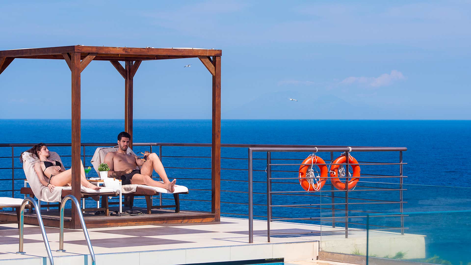 Umbrellas, sun loungers at the pool and beach 10